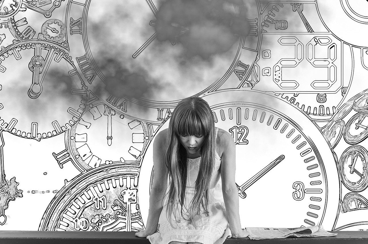 Girl in front of clocks