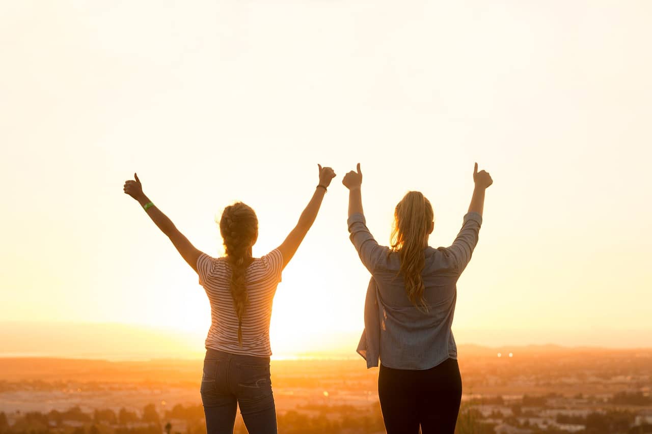 Why Friends Are Good For Our Soul - Two friends with their thumbs up
