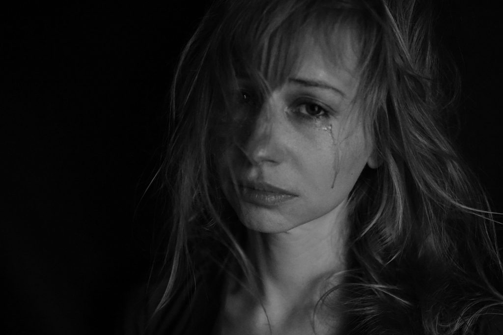 Woman Crying, sad from the affects of unrequited love
