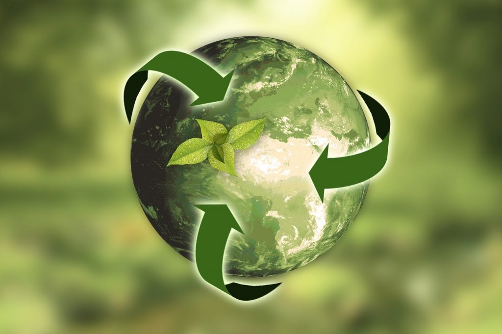 World with recycling symbol around it