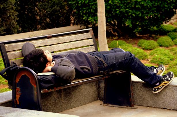 man lying on a bench