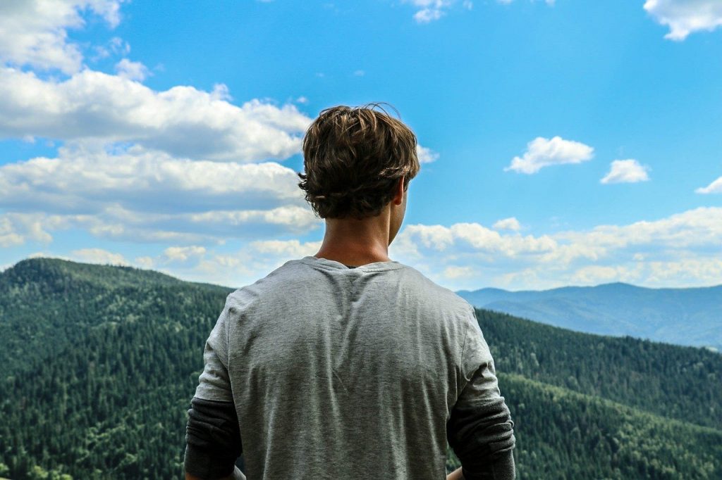 man in the outdoors practicing habits to help mental wellbeing