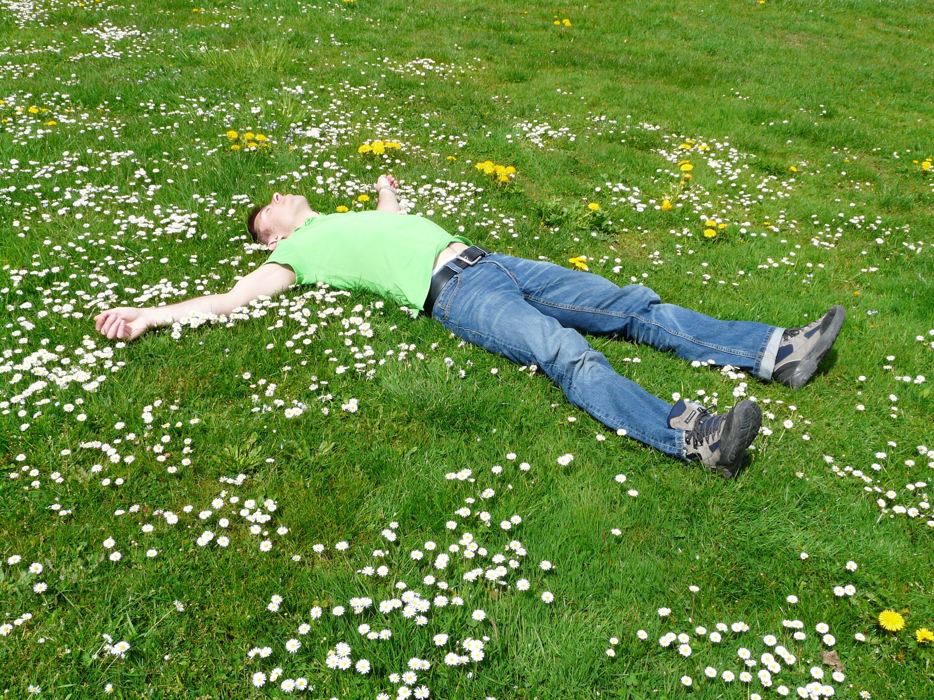 How to Relax - man lying on grass relaxing