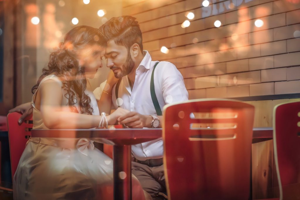 couple having a romantic meal - Places to go to be romantic