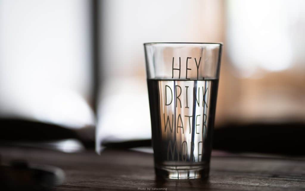 Glass with "hey, drink more water" written on it -Drink More Water - how to drink more water