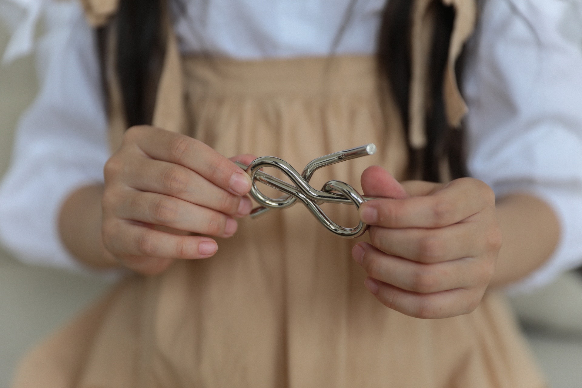 Girl holding a puzzle - Mental Wellbeing Products