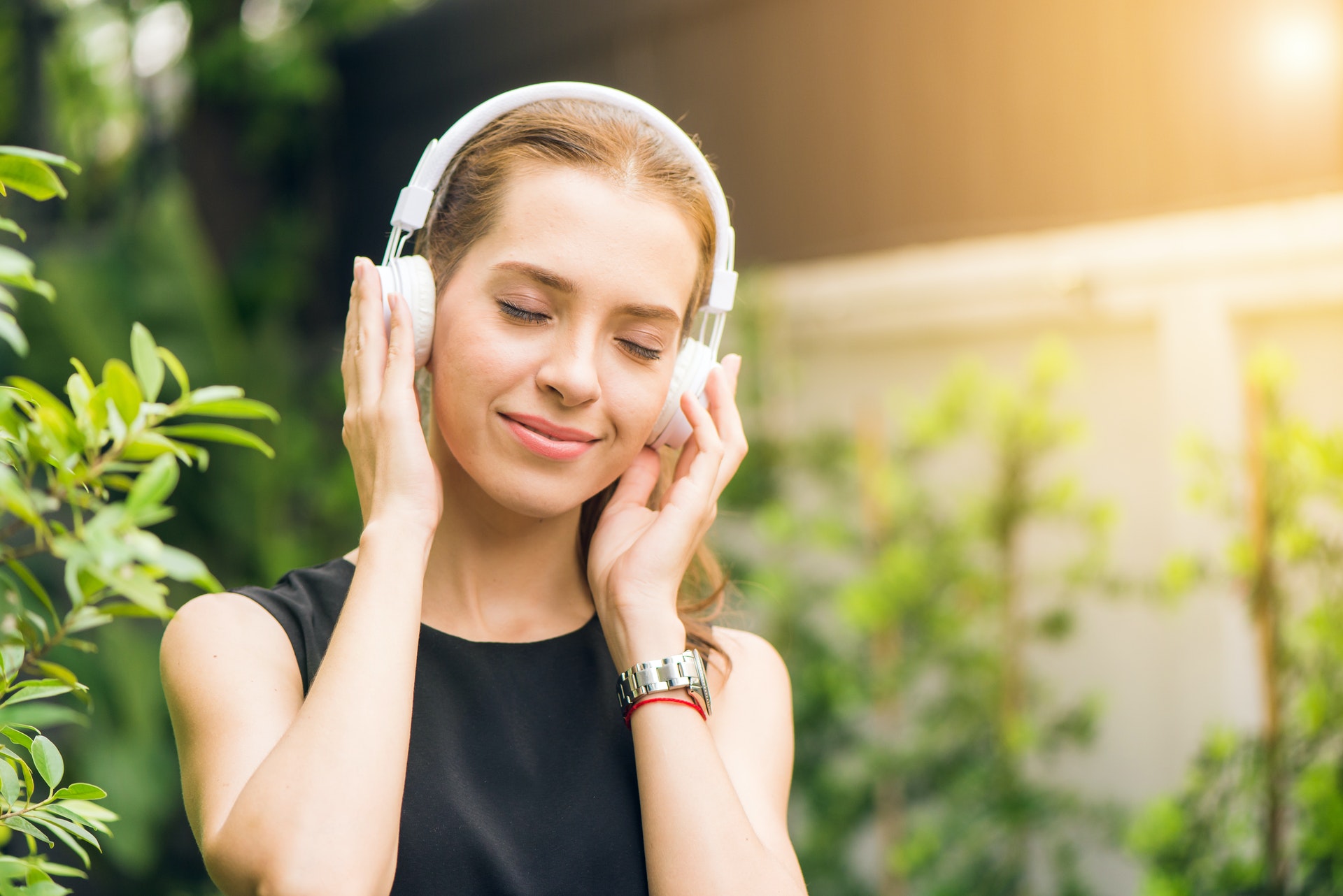 Woman listening to music looking happy - Mental Wellbeing Music
