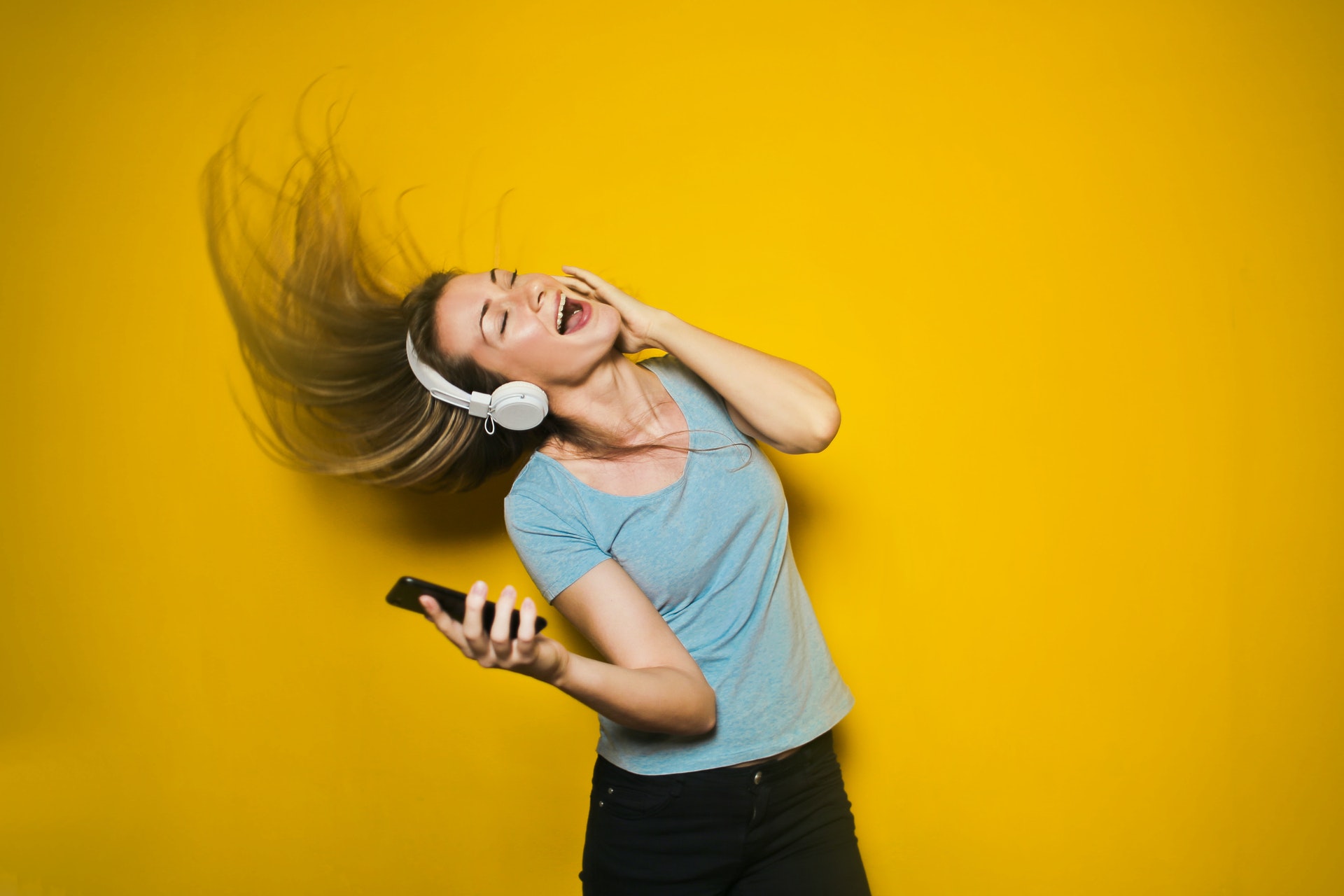 Woman looking happy - Physical Wellbeing podcasts