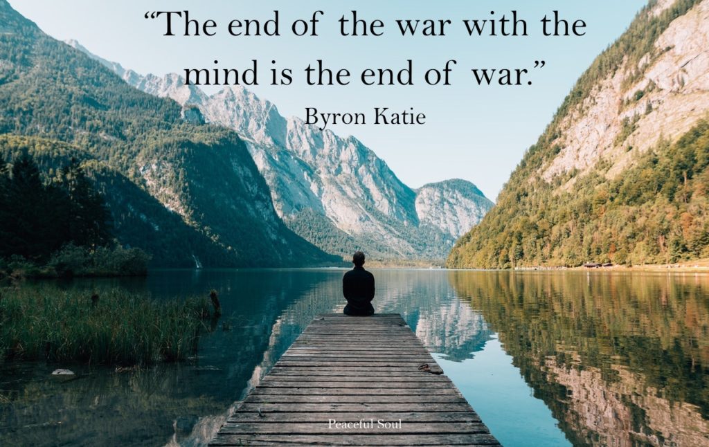 Man sat by a lake being peaceful and calm - “The end of the war with the mind is the end of war.”​ by Byron Katie. Inspirational Quotes About The Mind