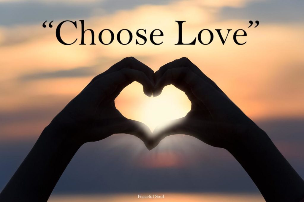 Person making a heart shape out of hands with the sun in the background - Choose Love - Quotes About Love