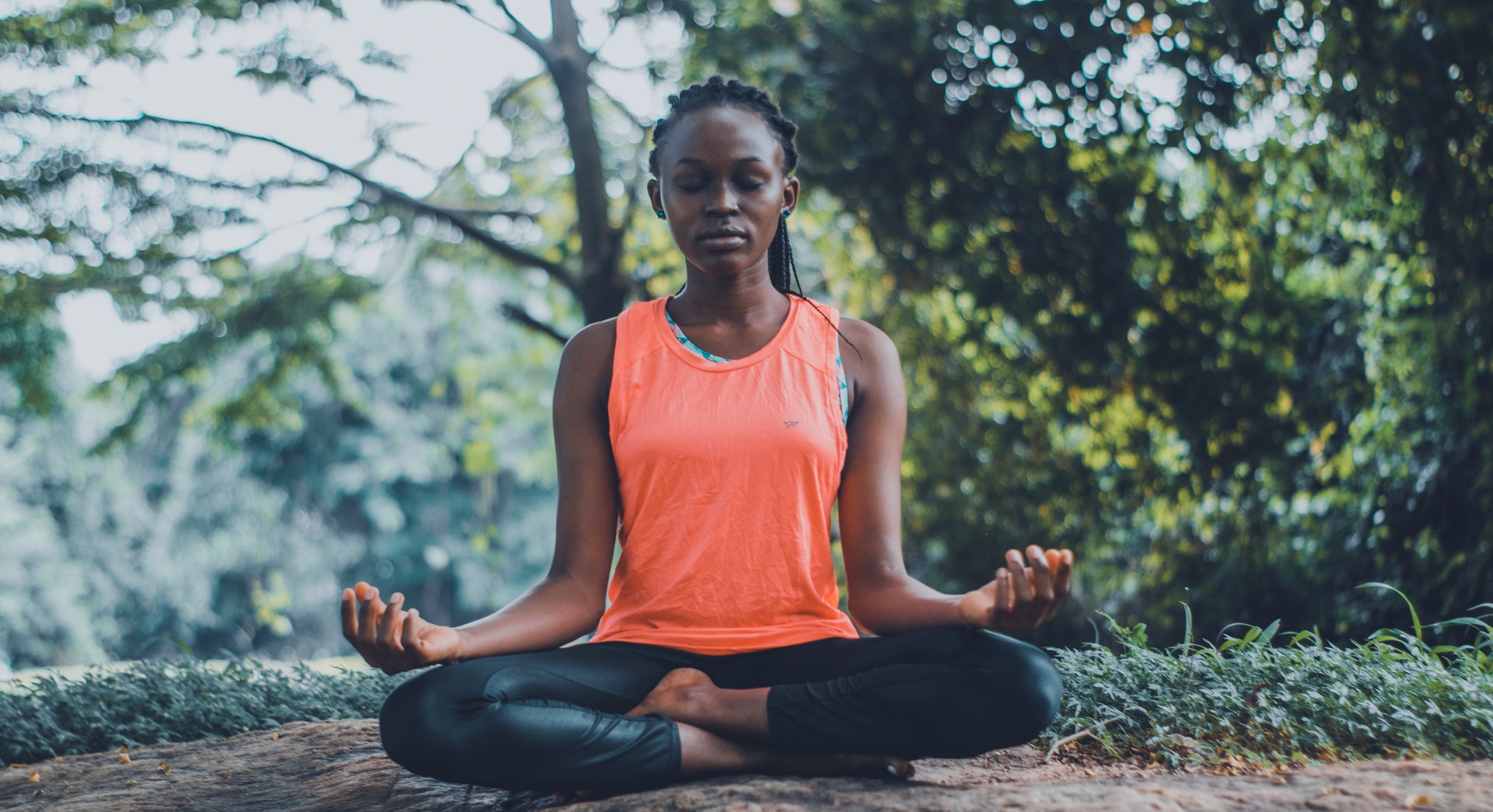 woman practicing meditation in nature - How to practice meditation and mindfulness for free