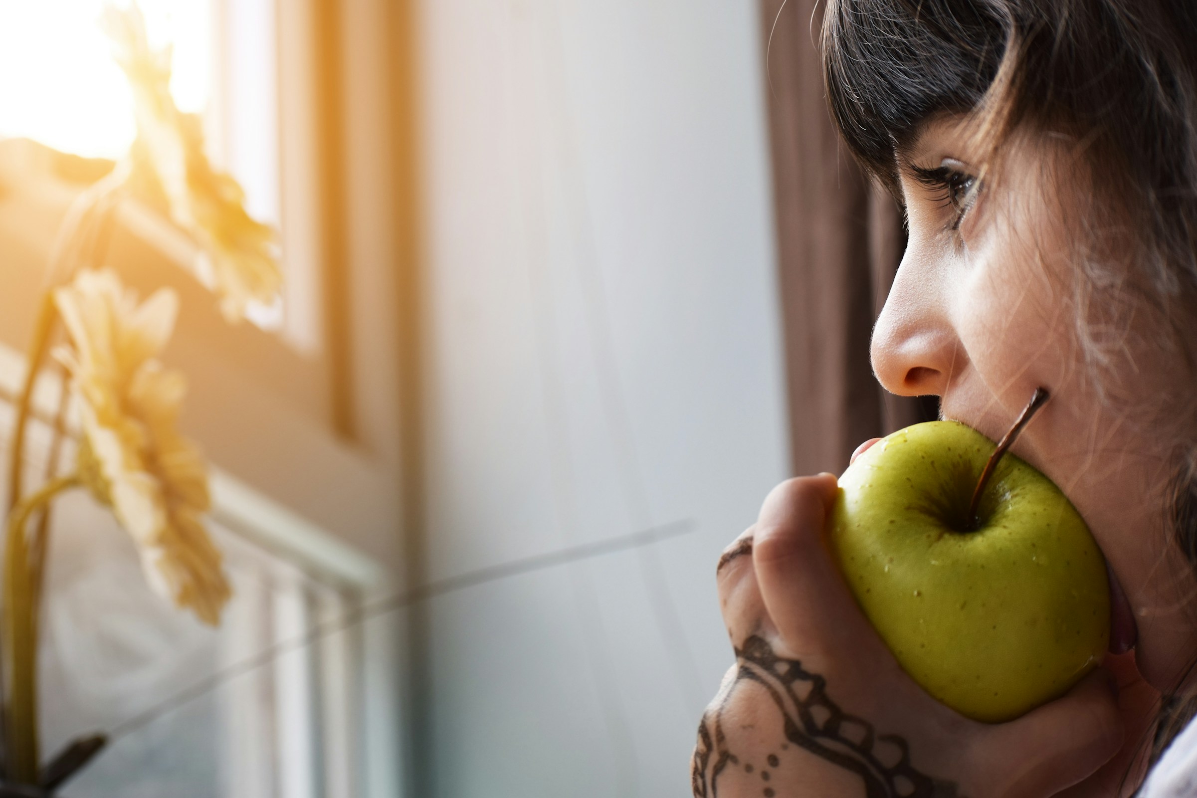 Child eating a healthy apple